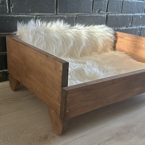 View of wooden cat bed in English Chestnut finish, at 45 degree angle