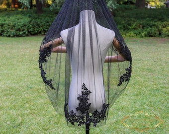 May include: A black bridal veil with a delicate lace trim and a floral crown. The veil is made of soft tulle and has a delicate sparkle.