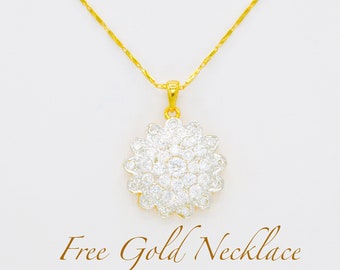May include: A gold chain necklace featuring a round pendant with a cluster of clear, sparkling stones arranged in a floral pattern. The text "Free Gold Necklace" is printed in a brown script font at the bottom of the image.