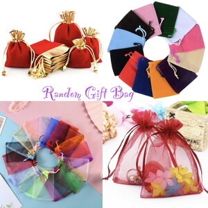 May include: Assortment of colorful drawstring gift bags in various sizes and materials.  The bags are made of velvet, satin, and mesh.  The bags are perfect for packaging small gifts, jewelry, or other small items.  The text "Random Gift Bag" is displayed in purple text.