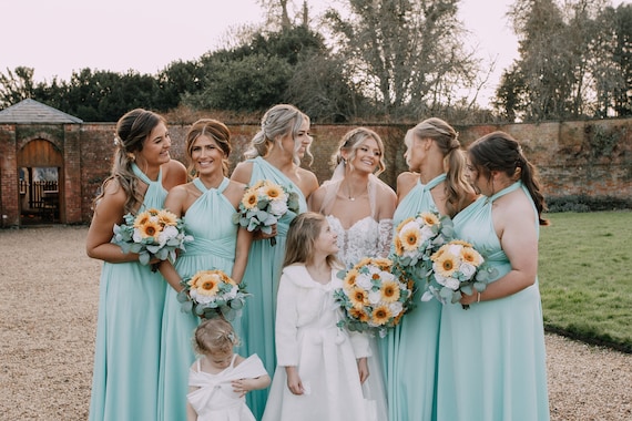 blue bridesmaid dresses with sunflowers Bridesmaids in Royal Blue Cocktail Dresses with Sunflower Bouquets
