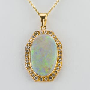 18k gold pendant with an opal and diamonds