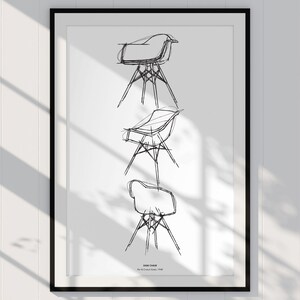 May include: A black and white line drawing of three different chair designs. The drawing is framed in a black frame and is hanging on a white wall.