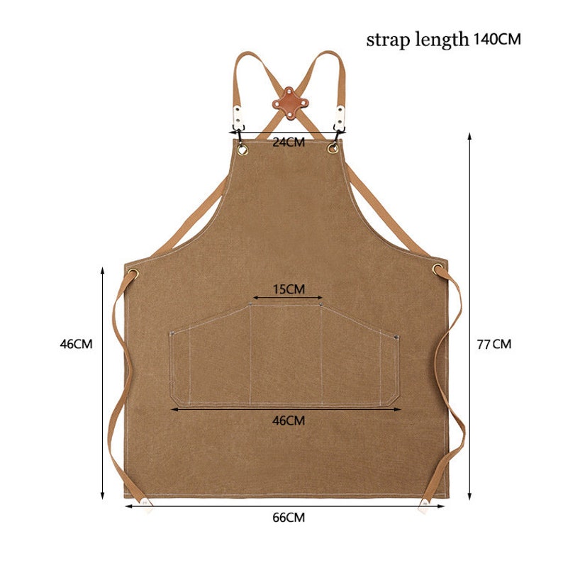 May include: A brown apron with leather straps and a pocket. The apron measures 66cm wide, 77cm long, and has a strap length of 140cm. The pocket is 46cm wide and 15cm high. The apron is designed for kitchen or workshop use.