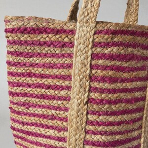Jute tote woven basket bag close up image of deep pink and natural, plain jute stripe