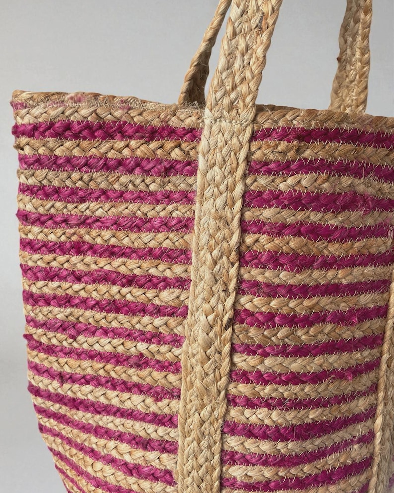 Jute tote woven basket bag close up image of deep pink and natural, plain jute stripe