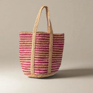 Handmade woven straw handbag with pink and beige stripes