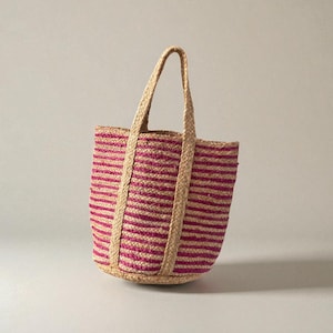 Braided jute shopping bag detail showing striped weave
