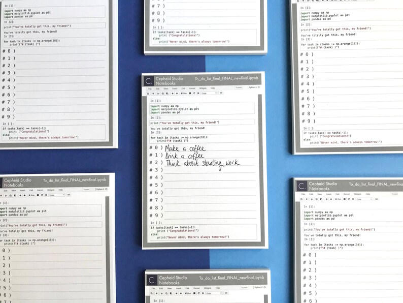May include: A set of five white lined notebooks with a gray border and the text "Cepheid Studio Notebooks" printed on the front. The notebooks have a to-do list format with numbered lines and a section for code. One notebook has handwritten notes that read "Make a coffee", "Drink a coffee", and "Think about starting work".