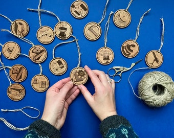 Wooden telescope baubles, celestial Christmas decorations