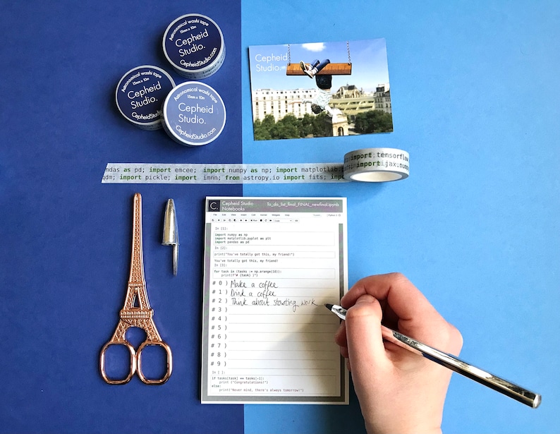 May include: A white notepad with a black and gray pen on top of it. The notepad has a black header that says "Cepheid Studio" and a list of to-dos written in black ink. The to-dos include "Make a coffee", "Drink a coffee", and "Think about starting work".