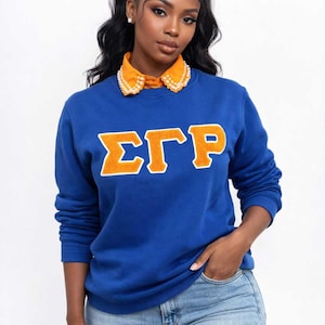 May include: A handmade, wooden cutting board with a natural finish. The board features a live edge on one side and a rectangular shape. It is approximately 18 inches long, 12 inches wide, and 1 inch thick.