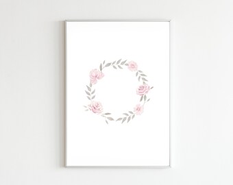 May include: A framed print featuring a watercolour floral wreath. The wreath is composed of pink roses and grey leaves arranged in a circular pattern. The artwork is set against a white background, framed in a silver border.