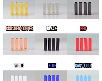 May include: A set of ten small metal rectangular bars in various colors, including gold, silver, gunmetal, brushed copper, black, red, white, blue, and baby blue. Each bar has a small screw on the top.