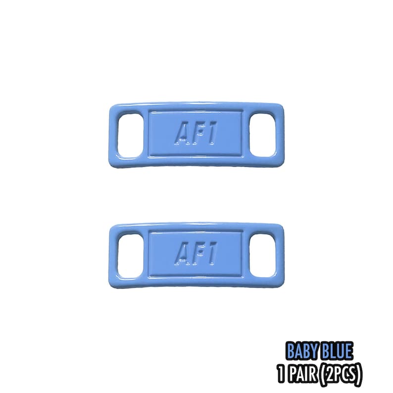 May include: Two baby blue AF1 shoe tags. Each tag has a rectangular center with rounded corners and the letters "AF1" in white. The tags have a hole on each end. The text "BABY BLUE 1 PAIR (2PCS)" is in the bottom right corner.
