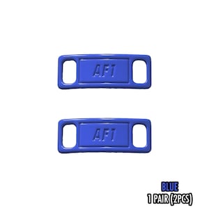 May include: Two blue shoe tags with the text "AF1" in white. Each tag has a rectangular shape with rounded corners and a hole on each end. The text "BLUE 1 PAIR (2PCS)" is at the bottom.