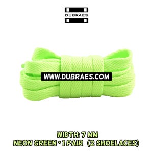 May include: Neon green shoelaces, 7 mm wide, in a pair of two. The shoelaces are a bright, vibrant green color. The text "WWW.DUBRAES.COM" is printed on a black rectangle. The text "NEON GREEN • 1 PAIR (2 SHOELACES)" is printed below the shoelaces.