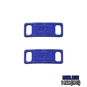 May include: Two royal blue shoe tags with the text "AF1" embossed on each. The tags have a rectangular shape with rounded corners and two holes. The text "ROYAL BLUE 1 PAIR (2PCS)" is at the bottom.
