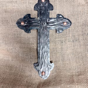 May include: A rustic wooden sign with the text "Welcome to our home" in white lettering. The sign features a distressed finish and a simple, inviting design, perfect for front door decor.