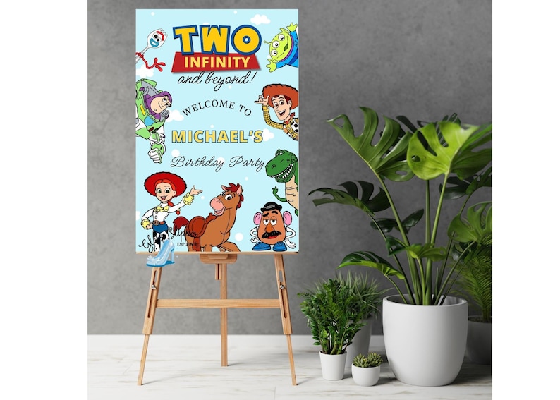 May include: A light blue birthday party sign featuring characters from the Toy Story movie. The sign reads "TWO INFINITY and beyond!" and "WELCOME TO MICHAEL'S Birthday Party". The sign is displayed on a wooden easel.