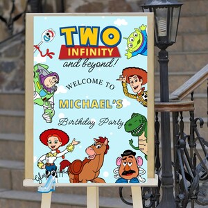 May include: A light blue sign with the words "TWO INFINITY and beyond!" and various Toy Story characters. The sign welcomes guests to Michael's Birthday Party. The sign is displayed on a wooden easel.