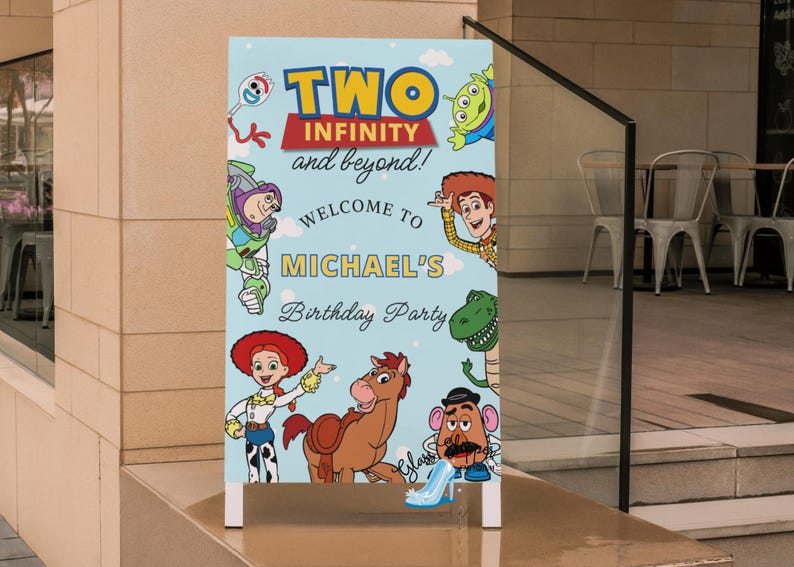 May include: A light blue sign with the text "TWO INFINITY and beyond!" and "WELCOME TO MICHAEL'S Birthday Party" featuring cartoon characters from Toy Story. The sign is placed on a concrete surface.