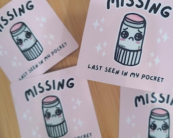 May include: Four pink stickers with a cartoon lip balm with a sad face and the text "MISSING LAST SEEN IN MY POCKET".