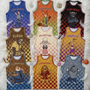 May include: Nine colorful basketball jerseys featuring characters from Zootopia. Each jersey has a character's name printed on it, such as "Judy Hopps", "Nick Wilde", and "Chief Bogo". The jerseys have a checkered pattern and are displayed on a white, fluffy surface.