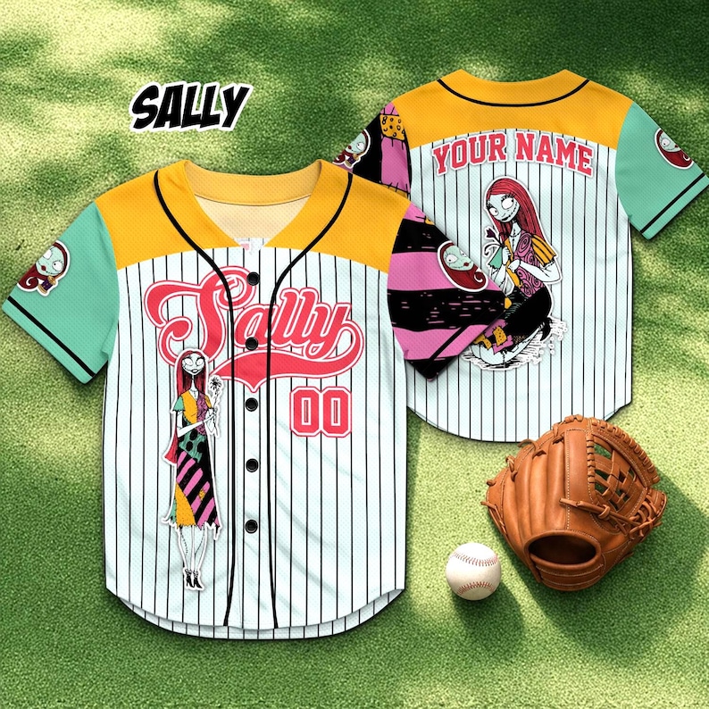 May include: White baseball jersey with black pinstripes, featuring a cartoon character design. The jersey has a yellow yoke, mint green sleeves, and the name "SALLY" in red script across the front. The number "00" is also displayed. A baseball glove and ball are next to the jersey.