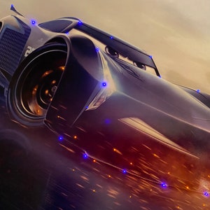 May include: A stylized image of a black race car with the number 28 on the side. The car has large eyes and a determined expression. The background is a blur of orange and yellow, suggesting speed.