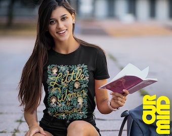 May include: A black t-shirt with a green floral design and the text "Little Women by Louisa May Alcott" in gold lettering.