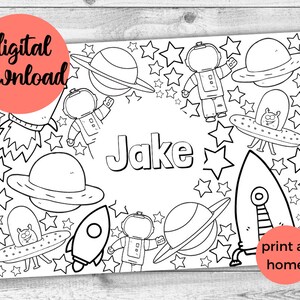 May include: Black and white printable coloring page featuring a space theme with planets, stars, rockets, and astronauts. The name "Jake" is written in large letters at the center of the page.