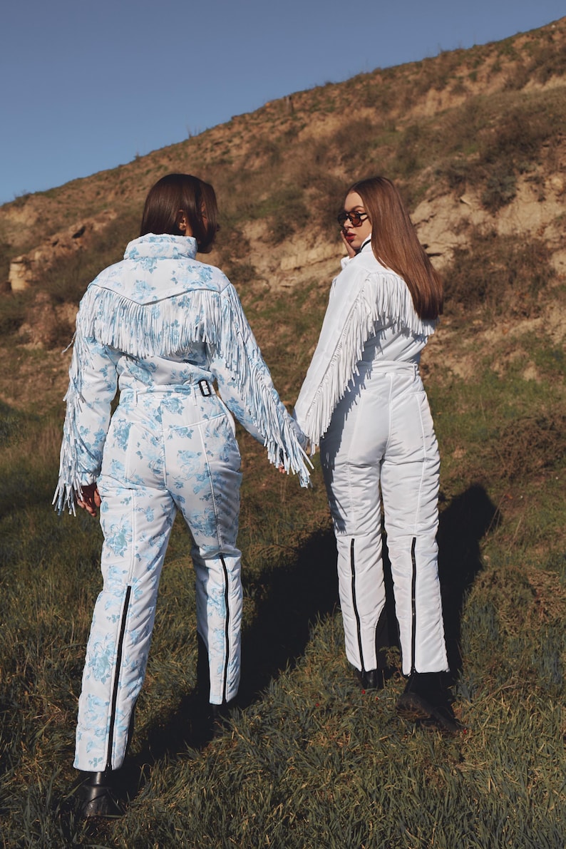 Traje de esquí blanco con flecos, traje de nieve de una pieza, traje de nieve blanco para mujer para deportes de invierno con borlas, mono cálido de invierno, traje de esquí y nieve. imagen 12