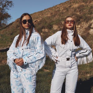 Traje de esquí blanco con flecos, traje de nieve de una pieza, traje de nieve blanco para mujer para deportes de invierno con borlas, mono cálido de invierno, traje de esquí y nieve. imagen 11