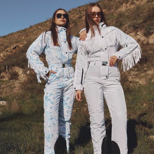 Traje de esquí blanco con flecos, traje de nieve de una pieza, traje de nieve blanco para mujer para deportes de invierno con borlas, mono cálido de invierno, traje de esquí y nieve. imagen 10