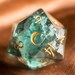 Samantha Sanborn reviewed D20 Engraved Green Fluorite Gemstone D20 Dice - Dungeons and Dragons D20, RPG Game DND Moon Version