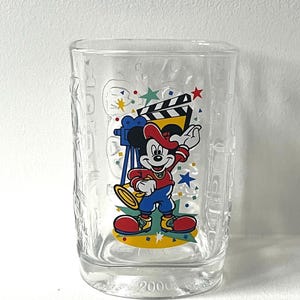 May include: A rustic wooden sign with the text "Welcome to our home" in white lettering. The sign features a distressed finish and a simple, inviting design, perfect for a front porch or entryway.