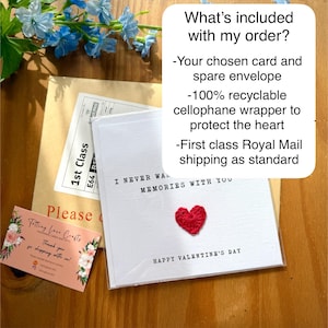 May include: A white card with a red crocheted heart and the text "I never want to forget our memories with you" and "Happy Valentine's Day". The card is packaged in a cellophane wrapper and includes a spare envelope.