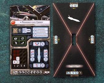 May include: A Star Wars: Armada game card for the Providence-class carrier. The card features a black and white illustration of the ship, along with its stats and abilities. The card is part of a larger set of cards used in the game.