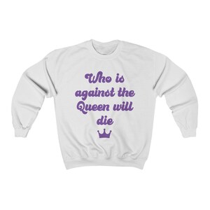 Who is Against the Queen Unisex Heavy Blend Crewneck Sweatshirt