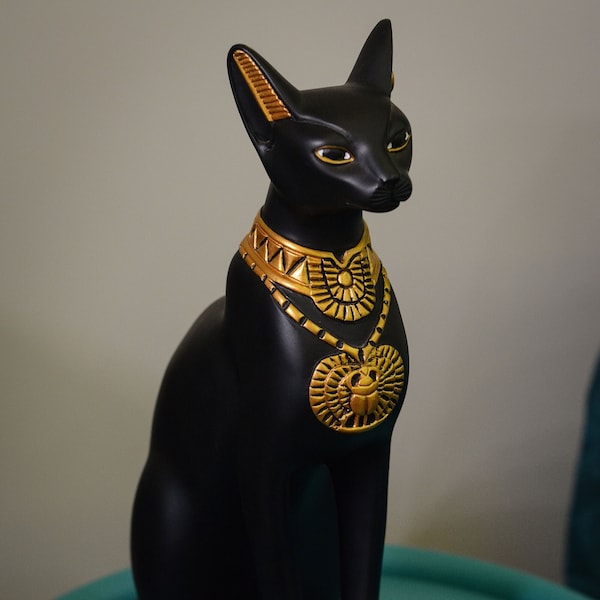 unique goddess Bastet cat large statue black gold painted, scarab on chest, symbols hieroglyphic inscriptions around the base made in Egypt