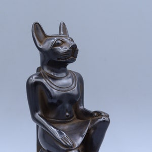 statue of Egyptian goddess Bastet seated Black solid stone made in egypt