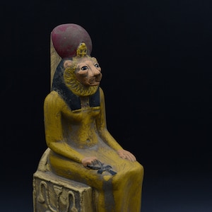 statue of Egyptian Goddess Sekhmet seated heavy painted stone made in egypt