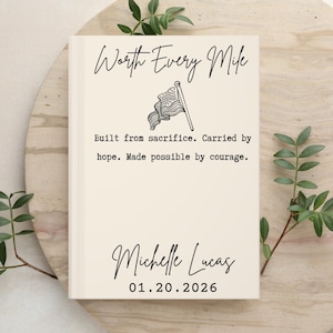 May include: A cream-colored book cover featuring the black text Worth Every Mile, a line drawing of an American flag, and the text Built from sacrifice. Carried by hope. Made possible by courage. Below is the name Michelle Lucas and date 01.20.2026.