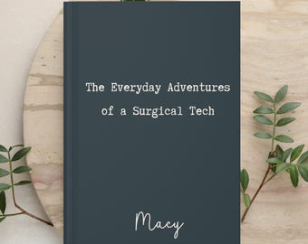 May include: A dark gray hardcover book with white text that reads The Everyday Adventures of a Surgical Tech and the name Macy in a white script font centered near the bottom of the front cover.
