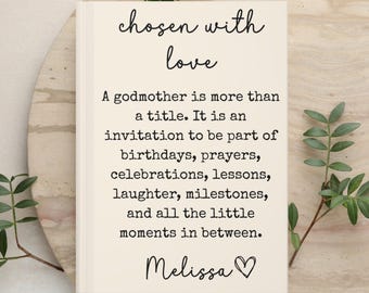 May include: A rectangular off-white card featuring the black printed text chosen with love followed by a paragraph about a godmother and the name Melissa with a heart symbol. The text lists birthdays, prayers, celebrations, lessons, and laughter.
