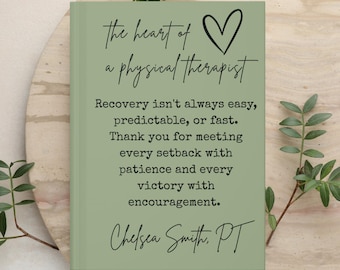 May include: A sage green rectangular book with black text that reads: the heart of a physical therapist, followed by a heart icon and a message about recovery, patience, and victory, ending with the name Chelsea Smith, PT.