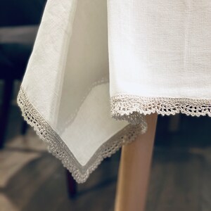 Wonderful white linen tablecloth with hand crochet gray lace borders; hand crochet table centerpiece for a beautiful dining room