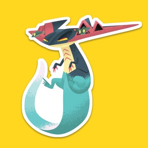 May include: A cartoon illustration of a blue and black creature with a red and pink head and a long tail. The creature has a fierce expression and is holding two smaller creatures in its mouth.