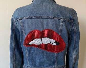 jean jacket with lips on the back